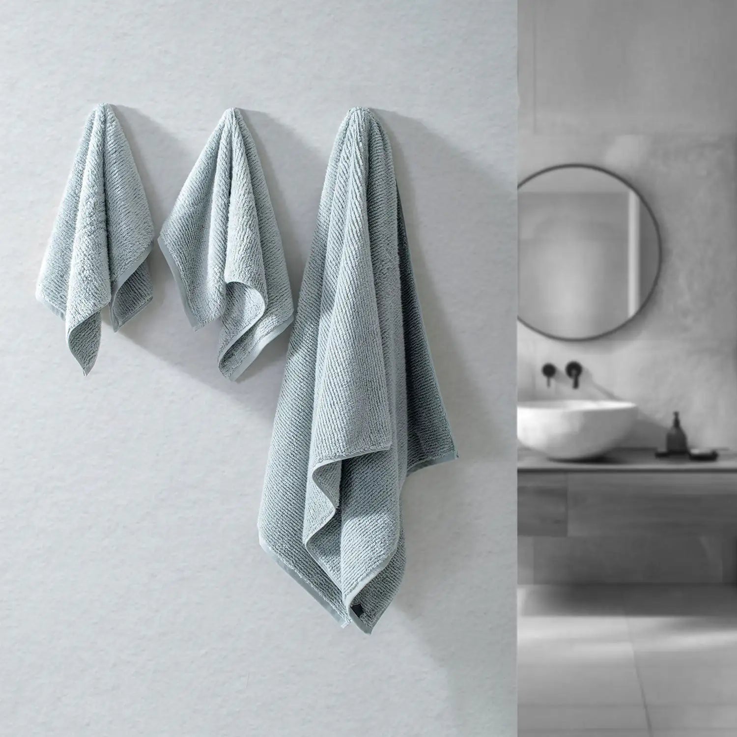 Earth Cotton 3-piece silver towel set – 100% cotton towels hanging on bathroom wall
